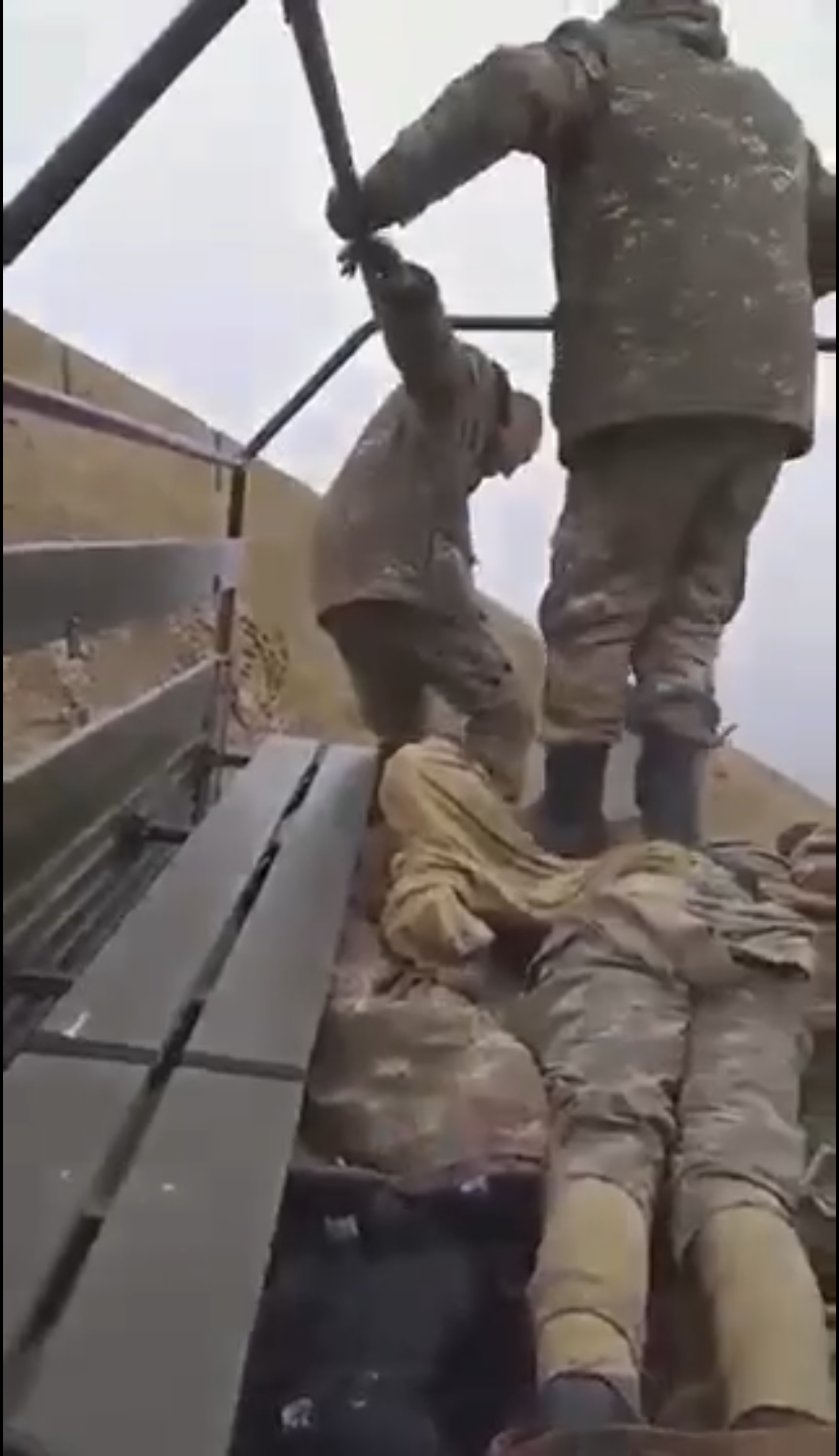 Armenian soldier strip naked and walk on bodies of Azerbaijani soldiers for fun